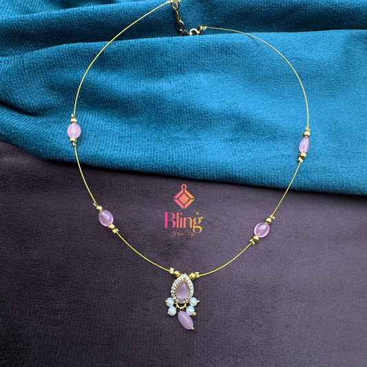 Whisper Light Chain – Gold Illusion Necklace with Pink Accents
